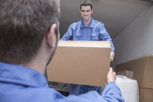 Team member reviewing ethical compliance documents for Finchley Man And Van