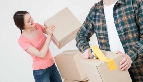 Packed moving boxes and furniture ready for transport