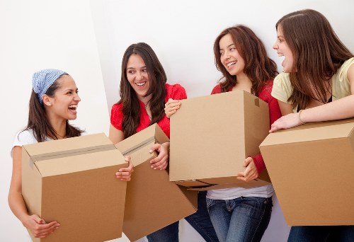 Removal van and moving team in a Finchley residential street