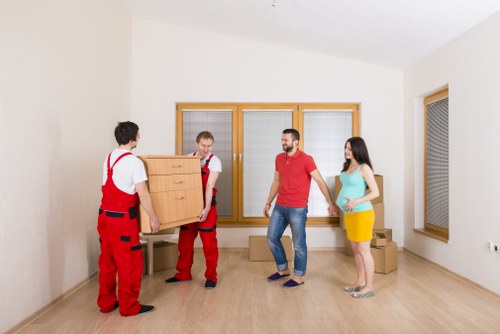 Sustainable removals team handling recycling-separated items in Finchley