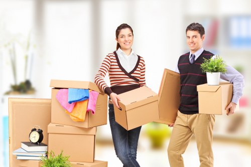 Local movers handling boxes near Finchley flats