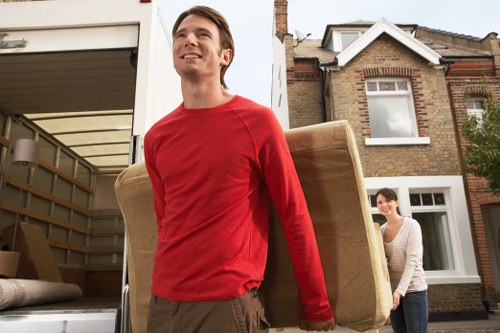 Low-carbon van loading boxed items for a sustainable Finchley move