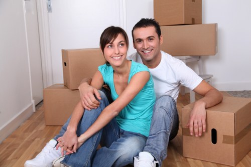 Team handling desks and equipment during an office move