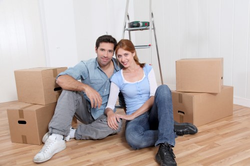 Careful wrapping of kitchenware and valuables for relocation