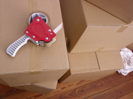Professional movers loading items for a Finchley house or flat move