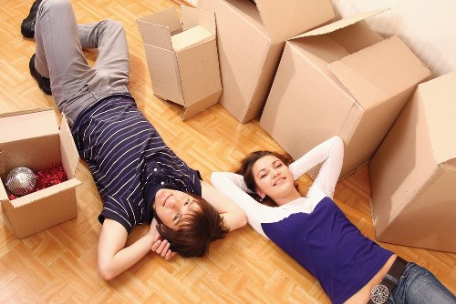 Packed moving boxes and furniture ready for transport in Finchley